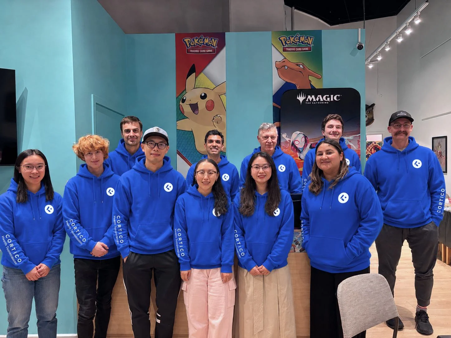 Cortico team members wearing blue Cortico hoodies