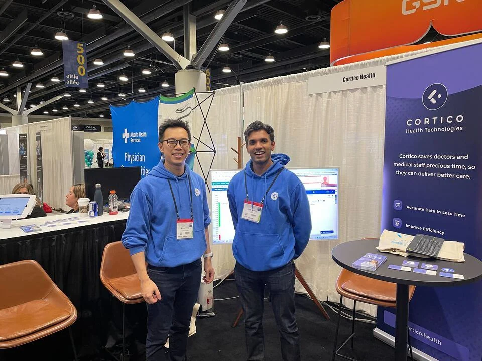 Cortico team members at a healthcare technology booth
