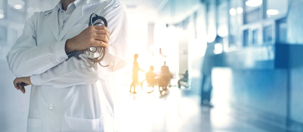 Doctor with arms crossed inside hospital
